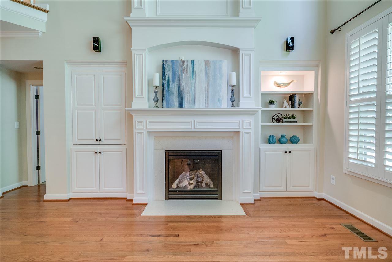 1016 Vino Drive Raleigh, NC 27607 - Photo 5 of 25 a view of an empty room with a fireplace and a window