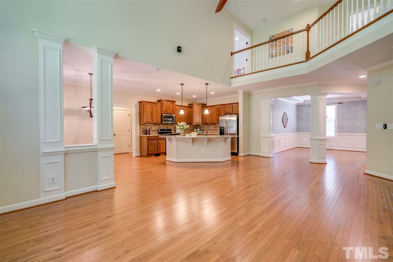 1016 Vino Drive Raleigh, NC 27607 - Photo 7 of 25 a view of a big room with kitchen view and stainless steel appliances