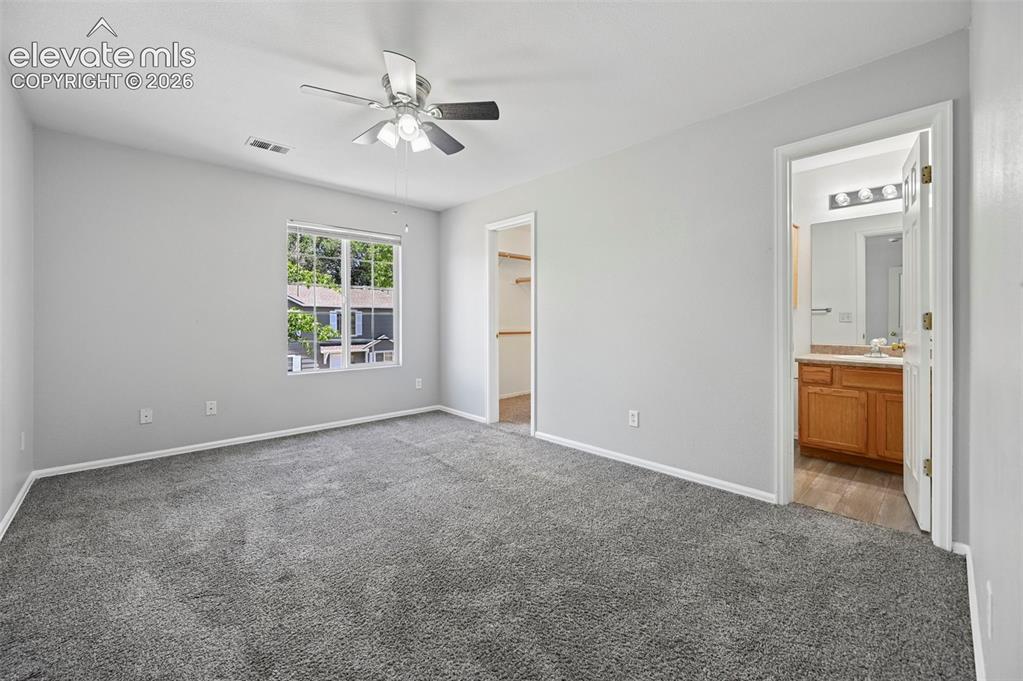 431 Kitfield View Colorado Springs, CO 80916 - Photo 18 of 27 a view of an empty room with a window