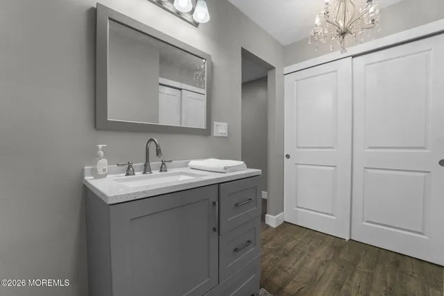 a bathroom with a sink and a mirror