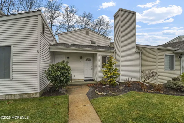 a view of a house with a yard and plants