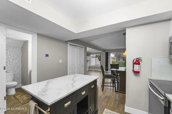 a kitchen with a table and chairs