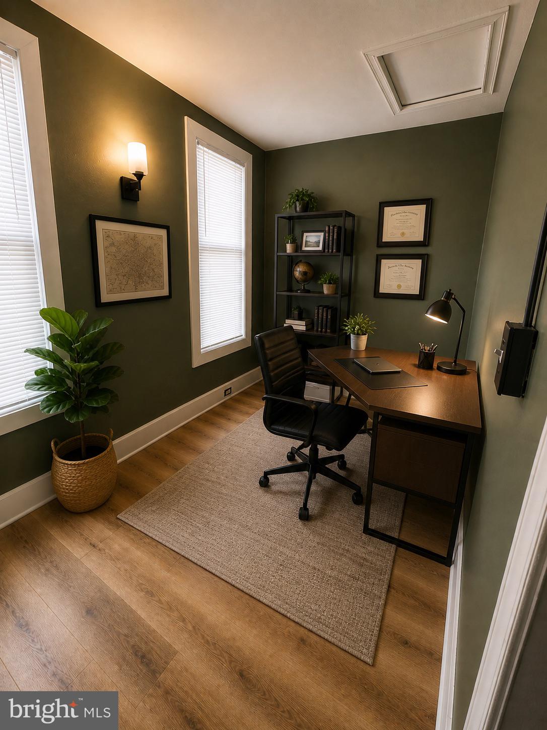 1402 Poplar Grove Street Baltimore, MD 21216 - Photo 5 of 5 a living room with furniture and a potted plant