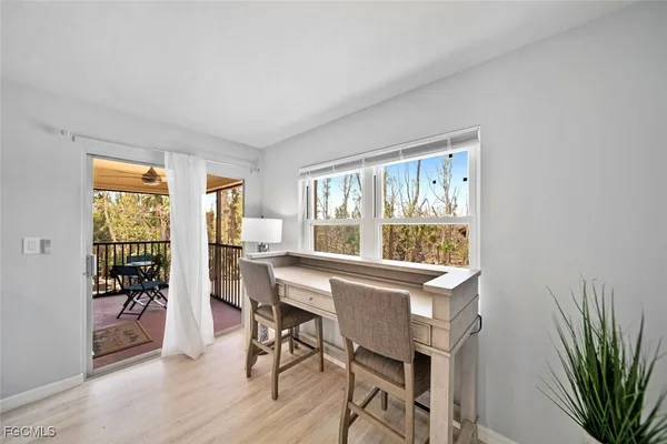 a view of a dining room with furniture window and outside view