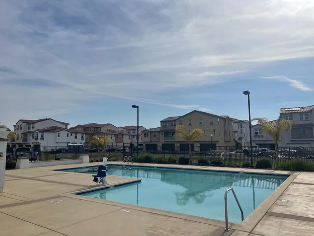 a view of a city with lawn chairs