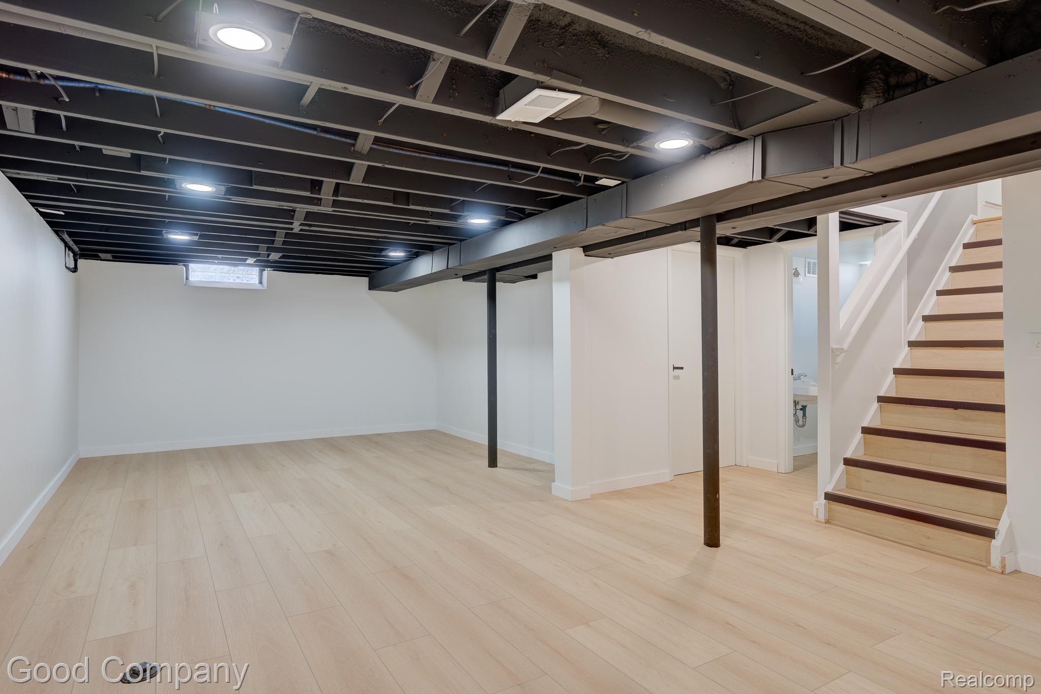 1842 Massoit Road Royal Oak, MI 48073 - Photo 29 of 52 Spacious room featuring light wood-finish flooring, recessed lighting, and a painted exposed ceiling