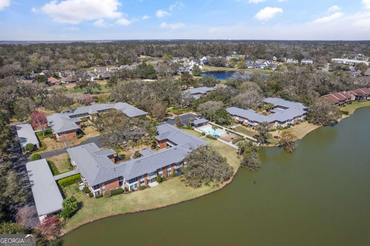 228 Sea Palms Colony, Unit 228C St. Simons, GA 31522 - Photo 1 of 32 an aerial view of residential houses with outdoor space and lake view