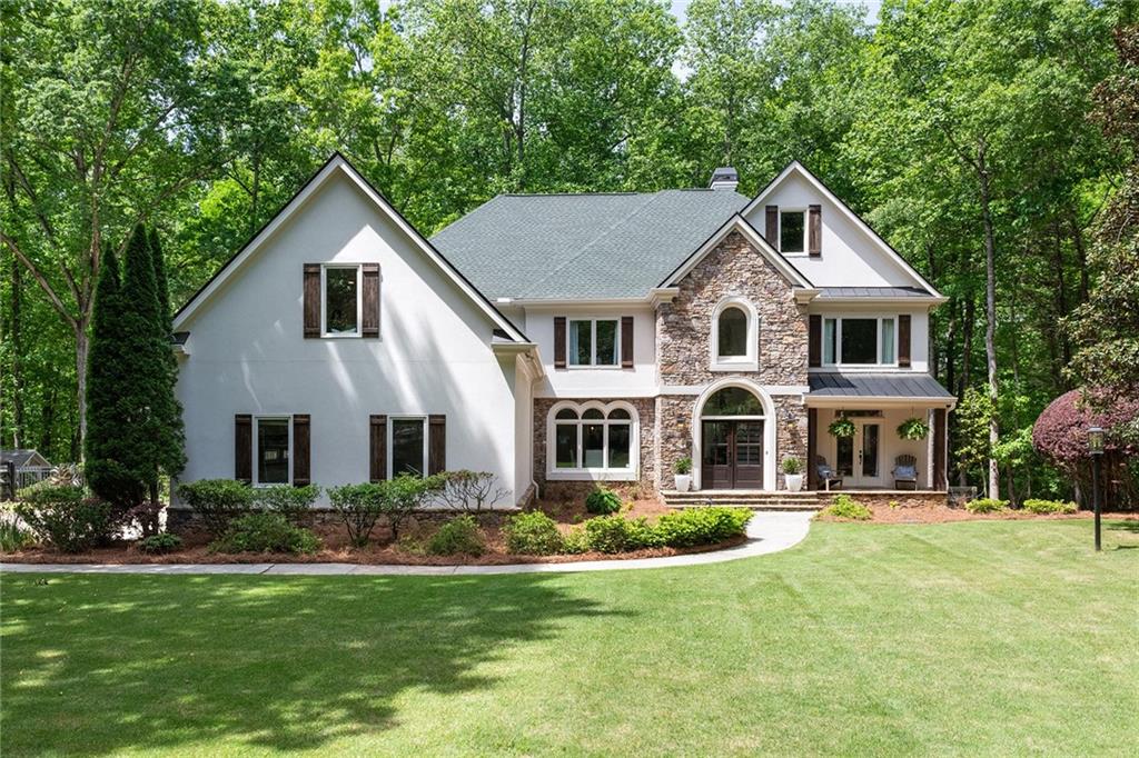 a front view of a house with a yard