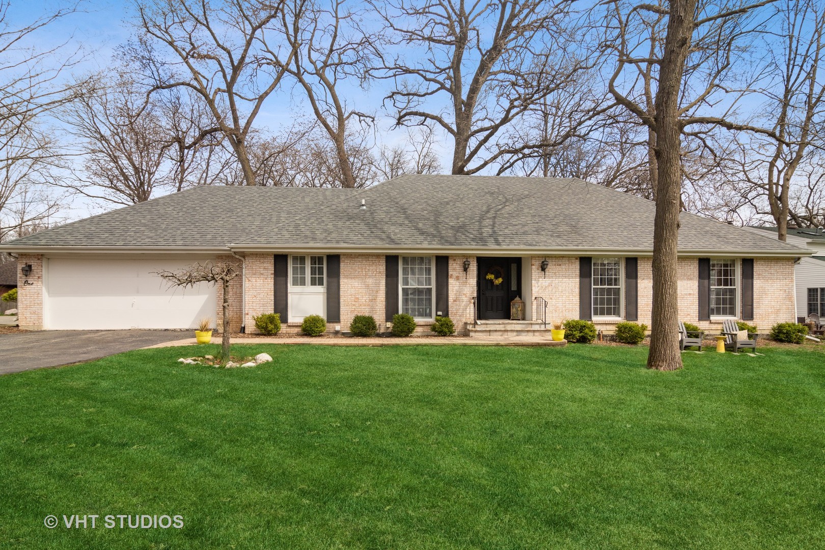 1 Applejack Road Rolling Meadows, IL 60008 - Photo 1 of 22 a front view of a house with a garden and trees