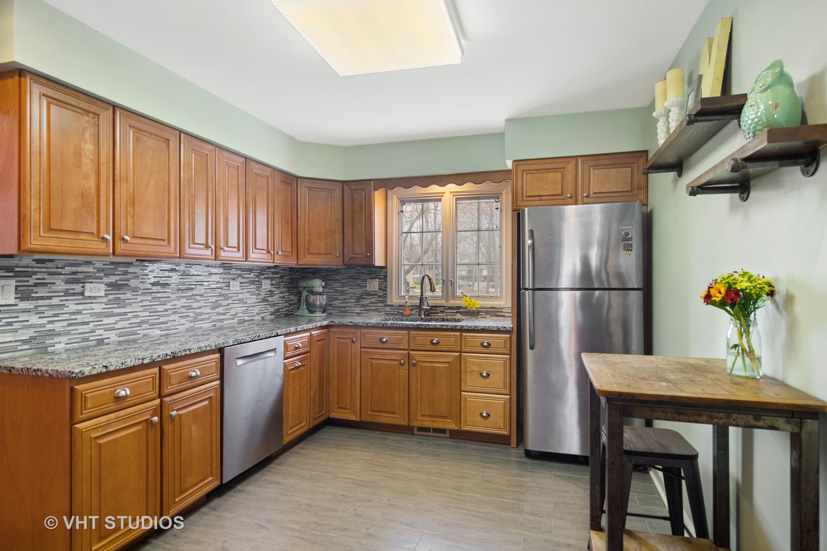 1 Applejack Road Rolling Meadows, IL 60008 - Photo 5 of 22 a kitchen with stainless steel appliances granite countertop a refrigerator sink and cabinets