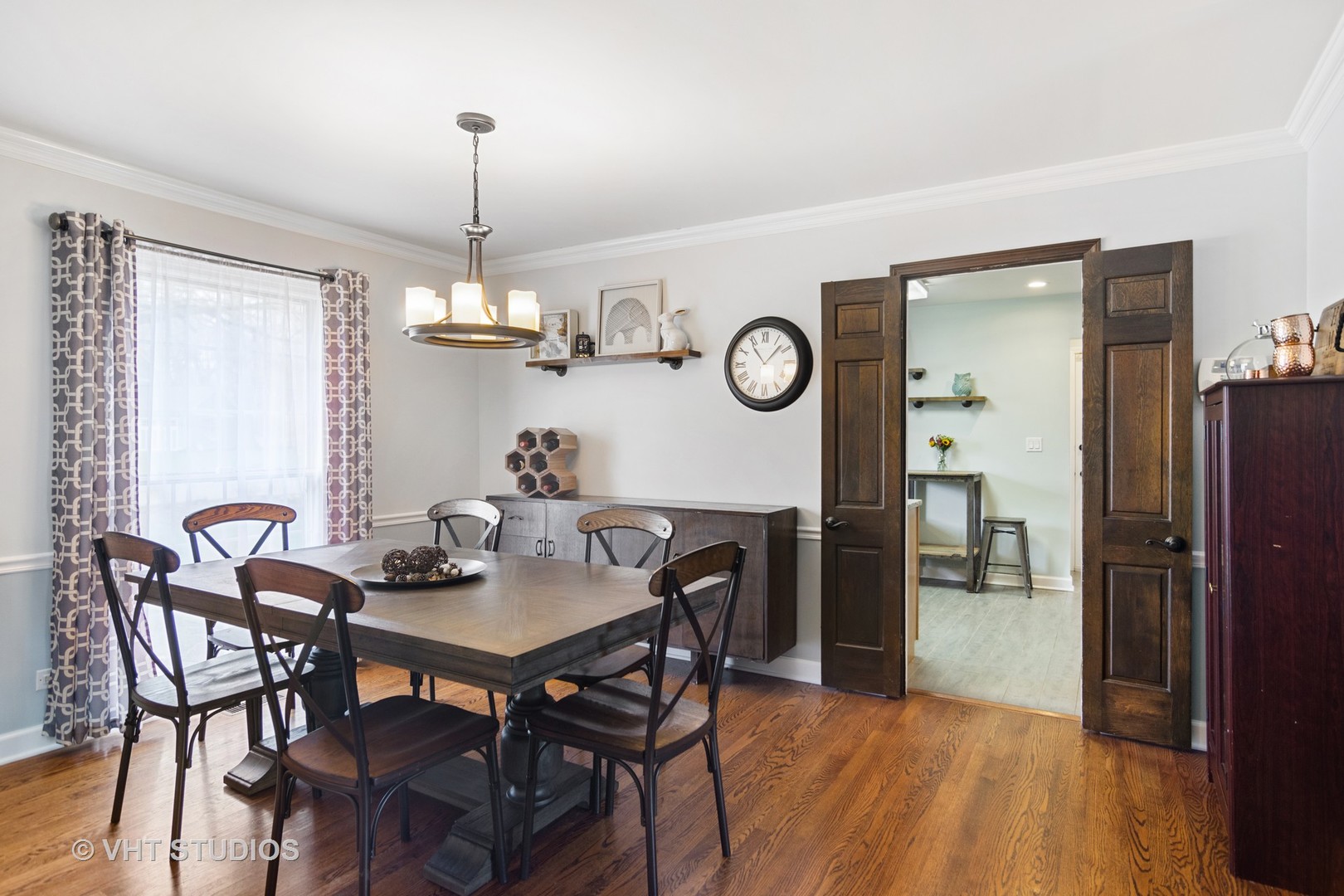 1 Applejack Road Rolling Meadows, IL 60008 - Photo 8 of 22 a view of a dining room and livingroom with furniture wooden floor a chandelier