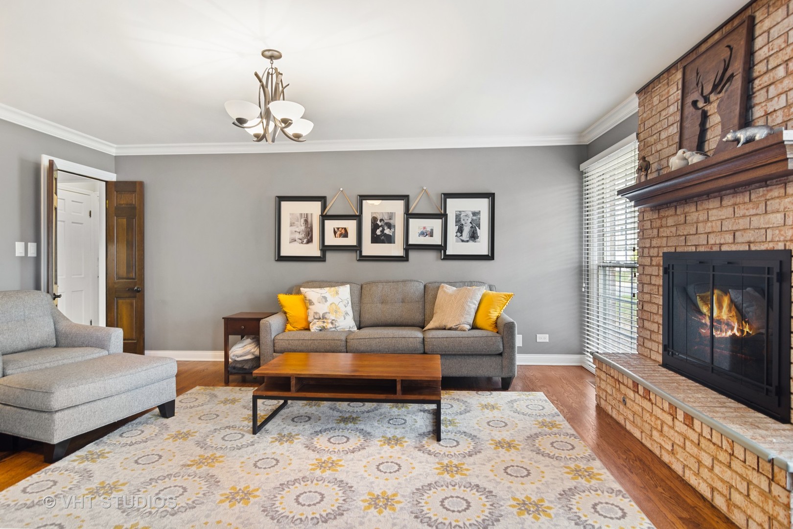 1 Applejack Road Rolling Meadows, IL 60008 - Photo 10 of 22 a living room with furniture a fireplace and a table