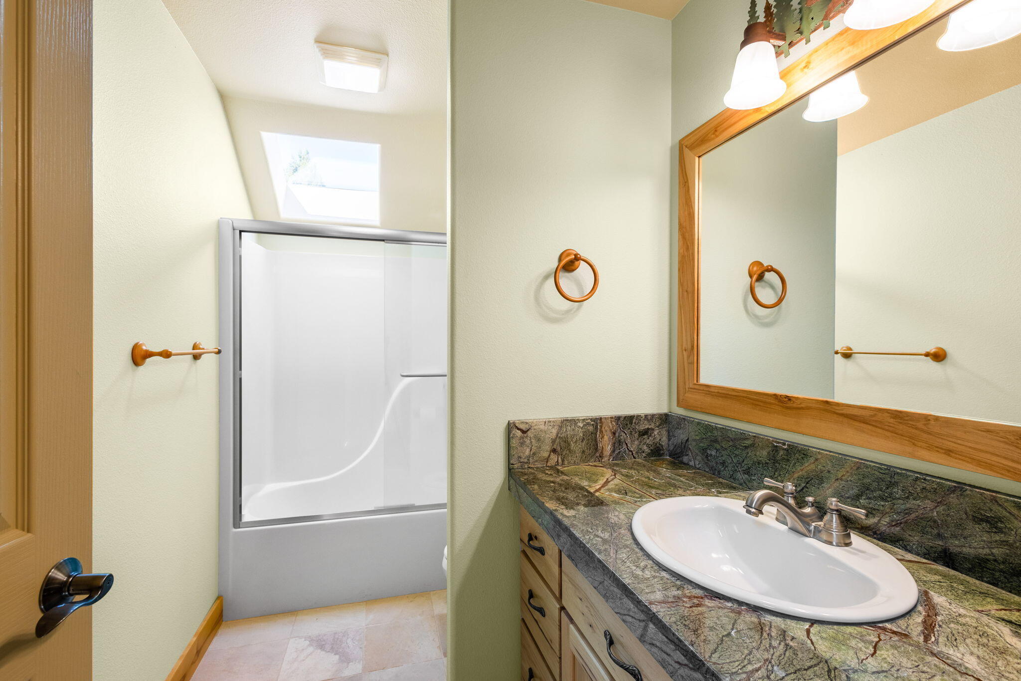 21405 Back Alley Road Bend, OR 97702 - Photo 30 of 48 a bathroom with a sink and a mirror