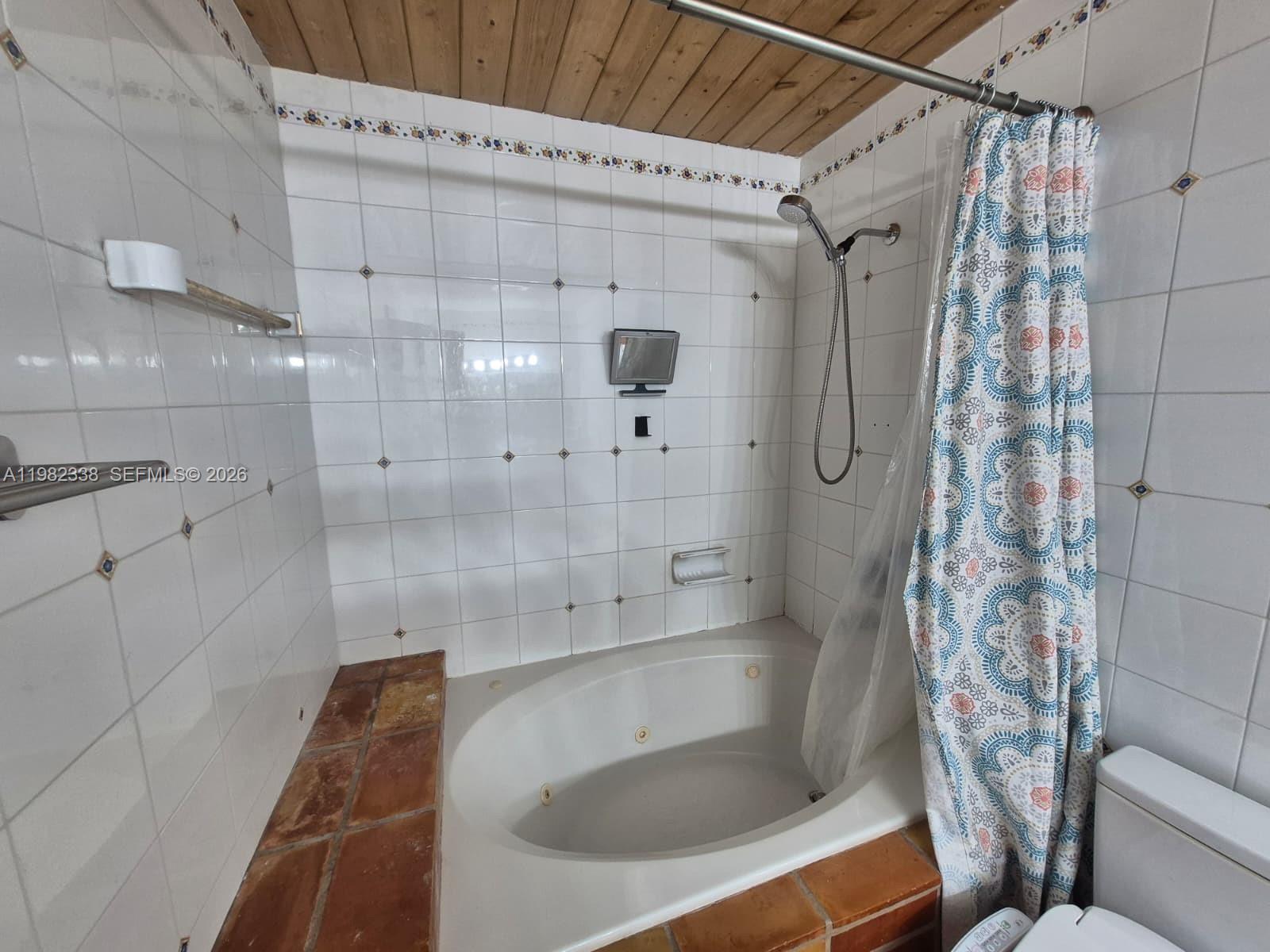 14530 Southwest 110th Street Miami, FL 33186 - Photo 21 of 45 a bathroom with a sink a toilet and shower
