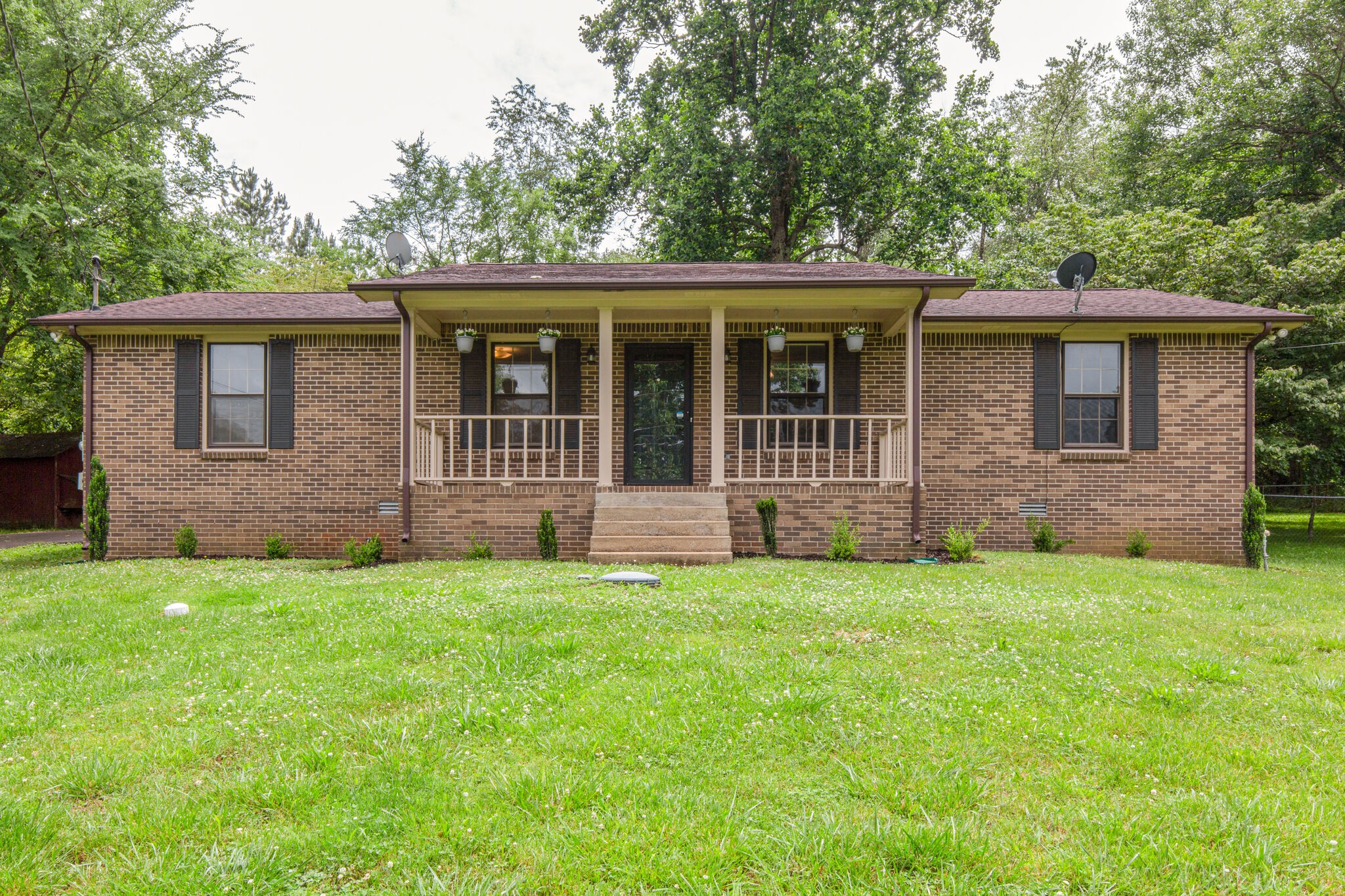 1022 Garton Road Burns, TN 37029 - Photo 1 of 23 a view of a house with a garden and deck