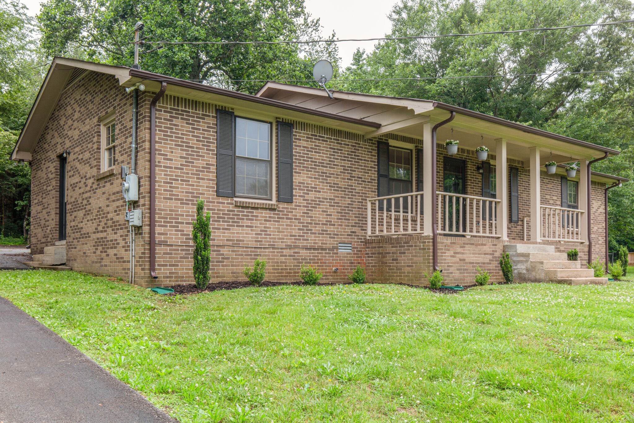 1022 Garton Road Burns, TN 37029 - Photo 2 of 23 a front view of a house with a garden