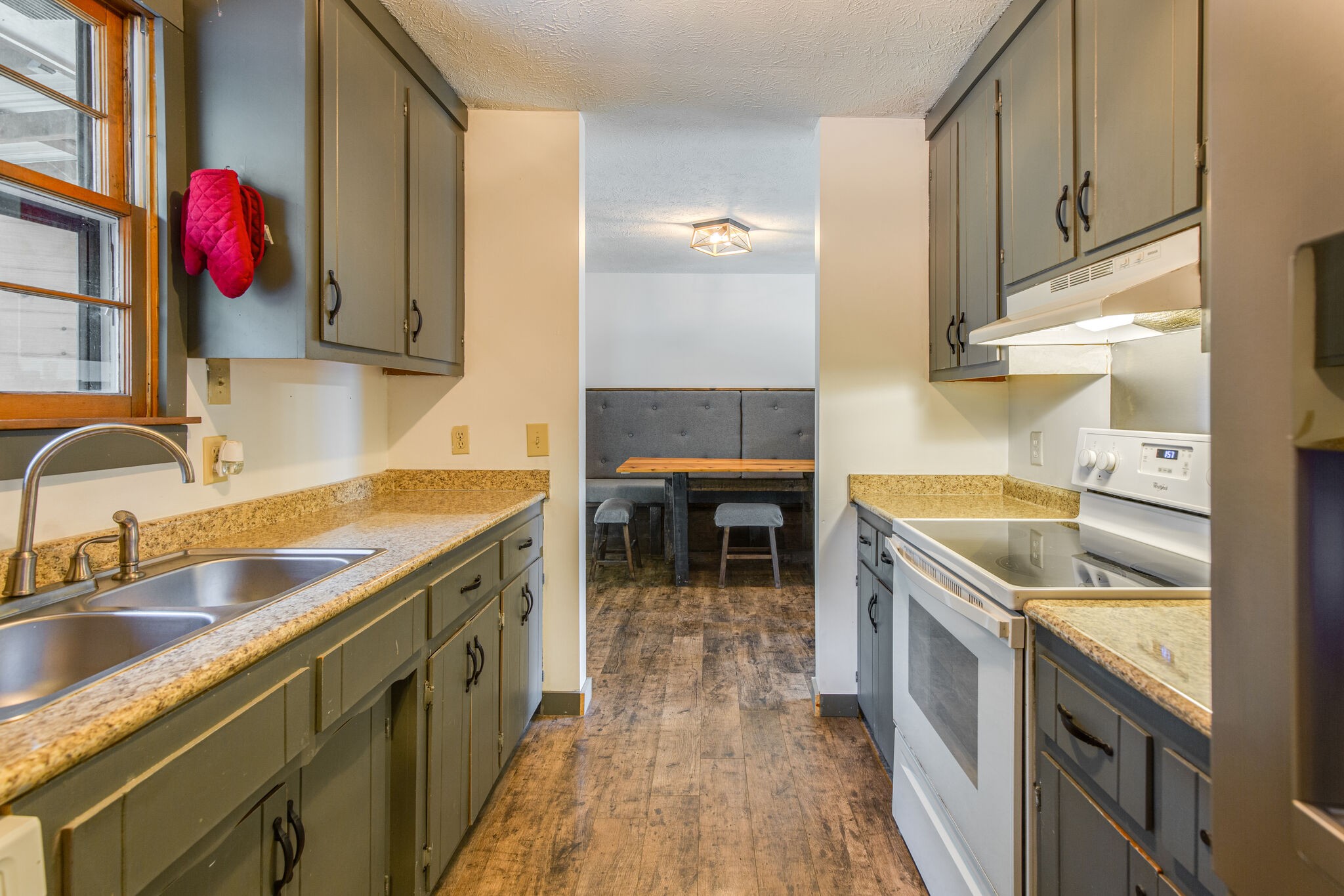1022 Garton Road Burns, TN 37029 - Photo 11 of 23 a kitchen with granite countertop a sink and a stove
