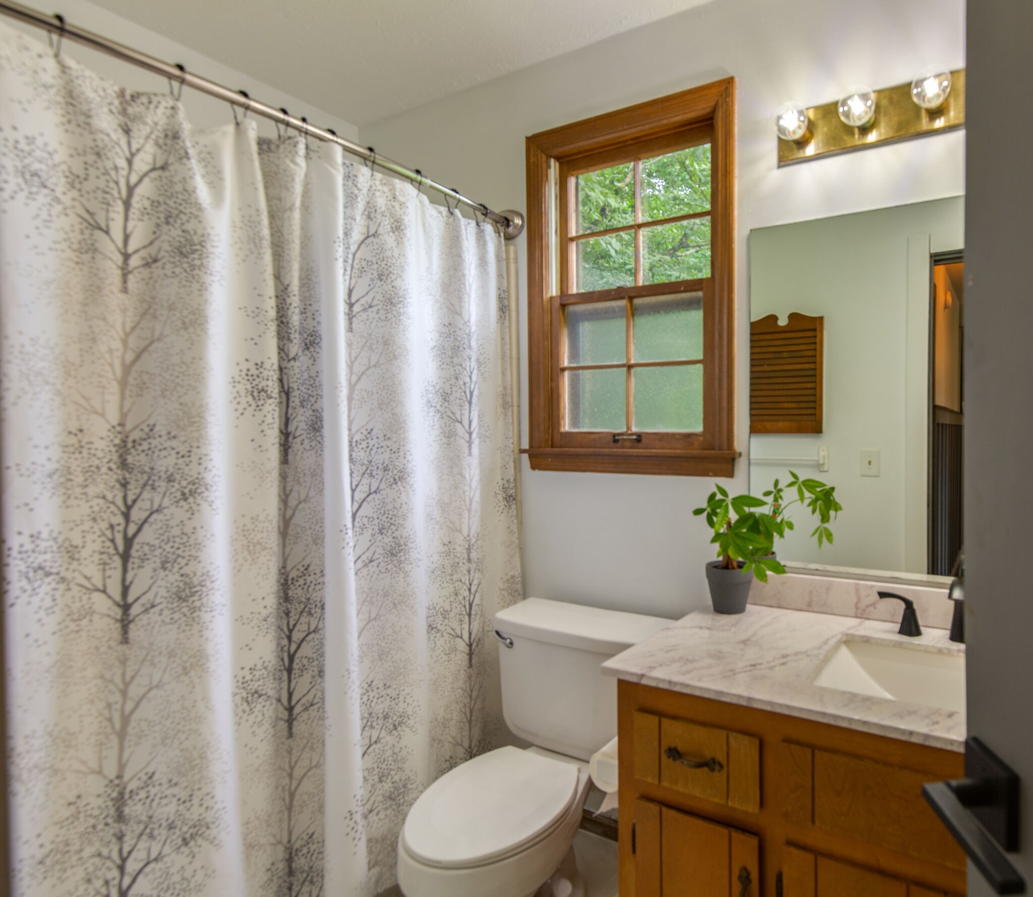 1022 Garton Road Burns, TN 37029 - Photo 17 of 23 a bathroom with a granite countertop sink and a mirror