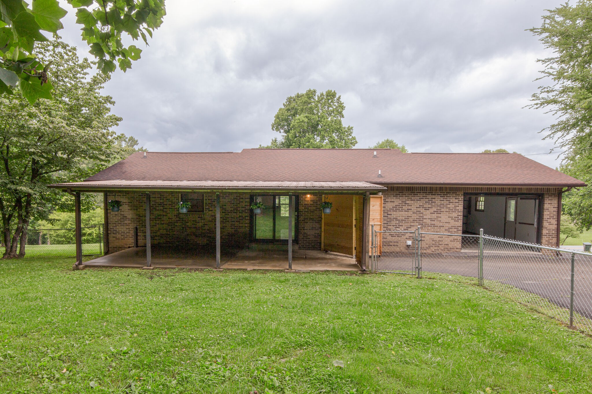 1022 Garton Road Burns, TN 37029 - Photo 19 of 23 a view of a house with a yard and sitting area