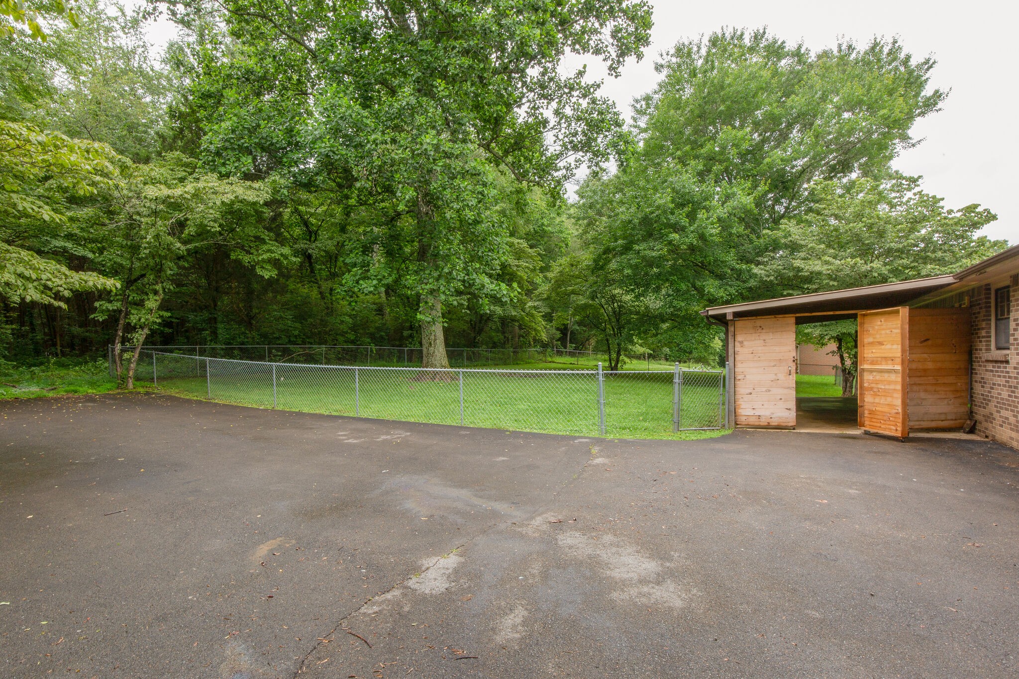 1022 Garton Road Burns, TN 37029 - Photo 20 of 23 a view of a house with a big yard