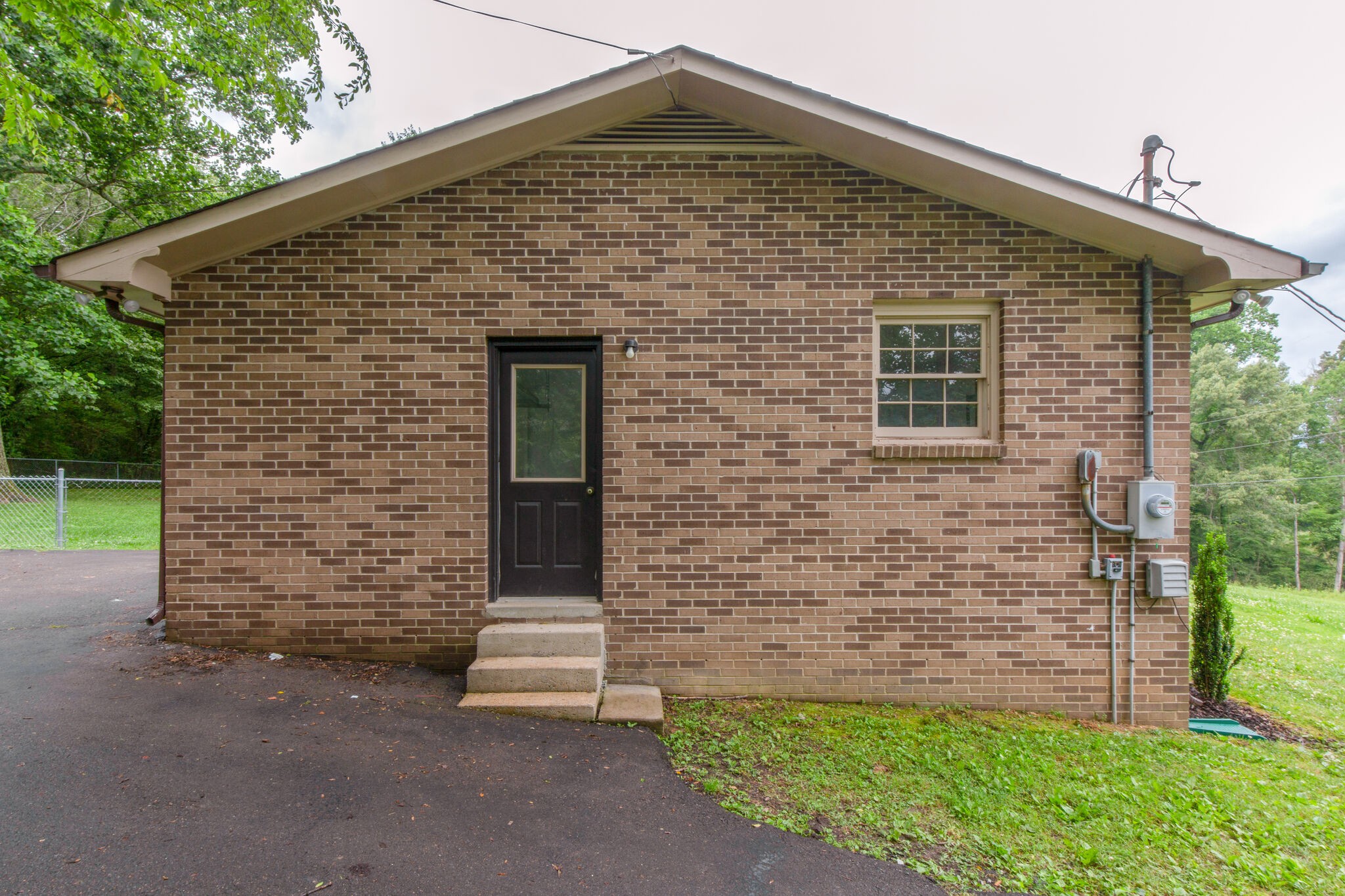 1022 Garton Road Burns, TN 37029 - Photo 21 of 23 a front view of a house with a garden
