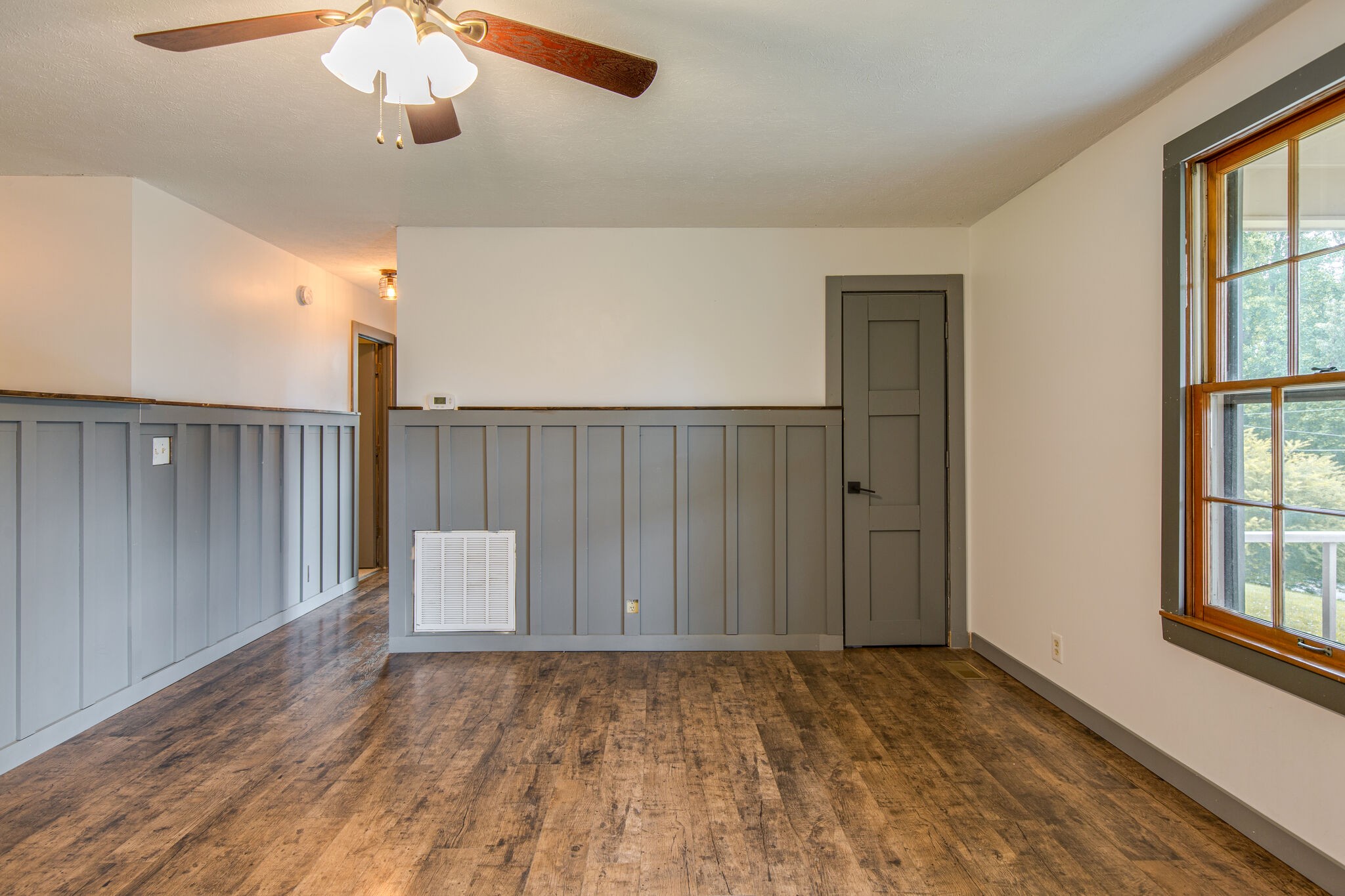1022 Garton Road Burns, TN 37029 - Photo 6 of 23 wooden floor in an empty room with a window