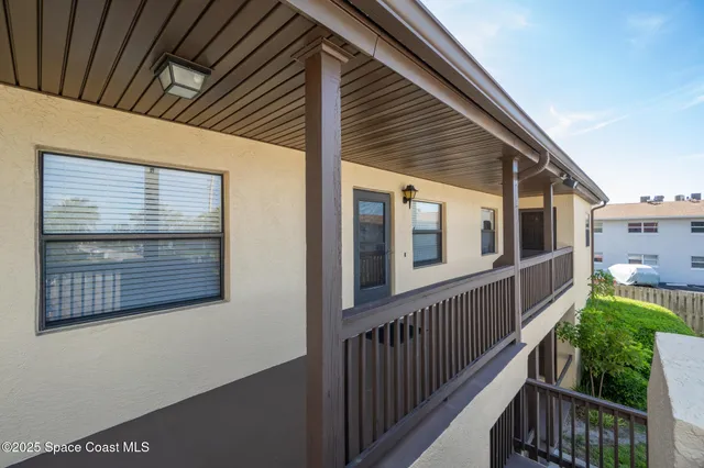 a aerial view of a house with table and chairs in patio