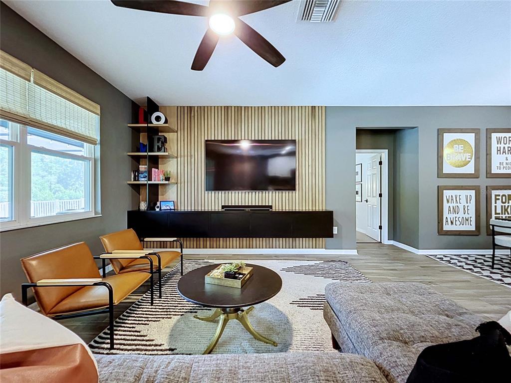 18078 Romanesque Court Spring Hill, FL 34610 - Photo 20 of 81 a living room with furniture and a flat screen tv