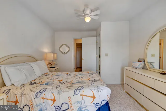 an aerial view of a residential houses with outdoor space and ocean view