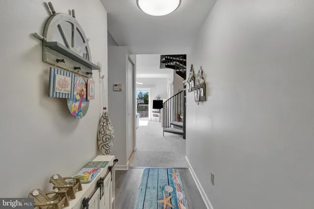 a kitchen with stainless steel appliances a refrigerator a sink a stove and cabinets