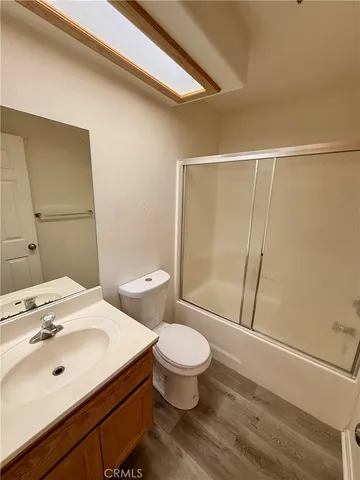 a white bath tub sitting next to a white toilet