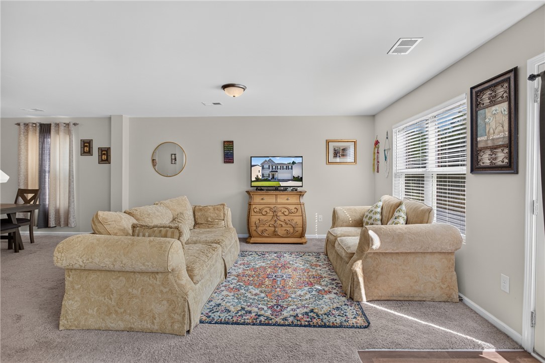 1081 Edenbrooke Circle Anderson, SC 29621 - Photo 3 of 46 A well-lit gathering space, perfect for relaxed evenings or entertaining guests.