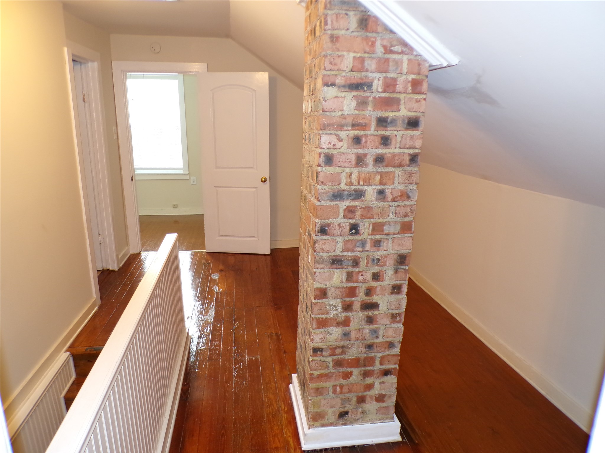 3416 Morrison Street, Unit 9 Houston, TX 77009 - Photo 26 of 38 Exposed brick - nice look. Stairs to the left.