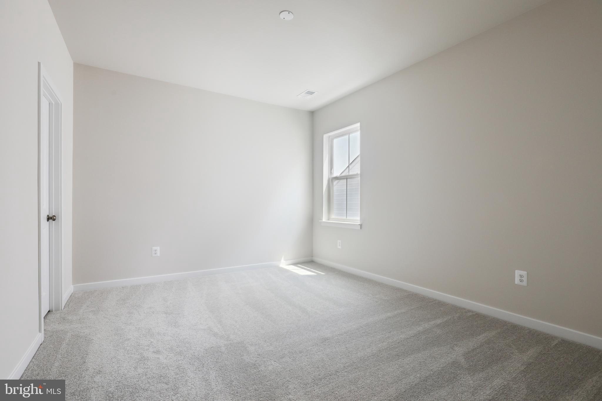1261 Red Clover Lane, Unit ASHTON 192 Ranson, WV 25438 - Photo 10 of 23 a view of an empty room with a window