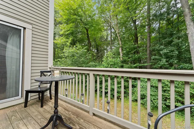 a view of a two chairs in the balcony