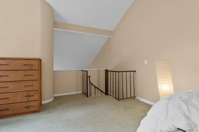 a view of room with cabinet and stairs