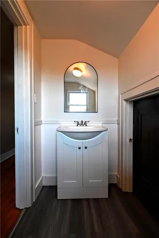 a bathroom with a sink and a mirror