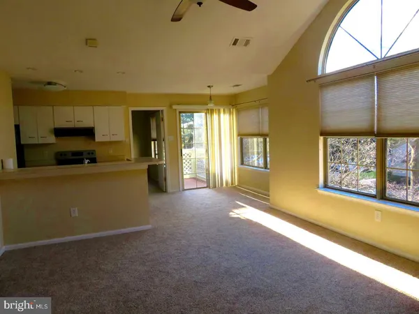 a view of livingroom with furniture and windows