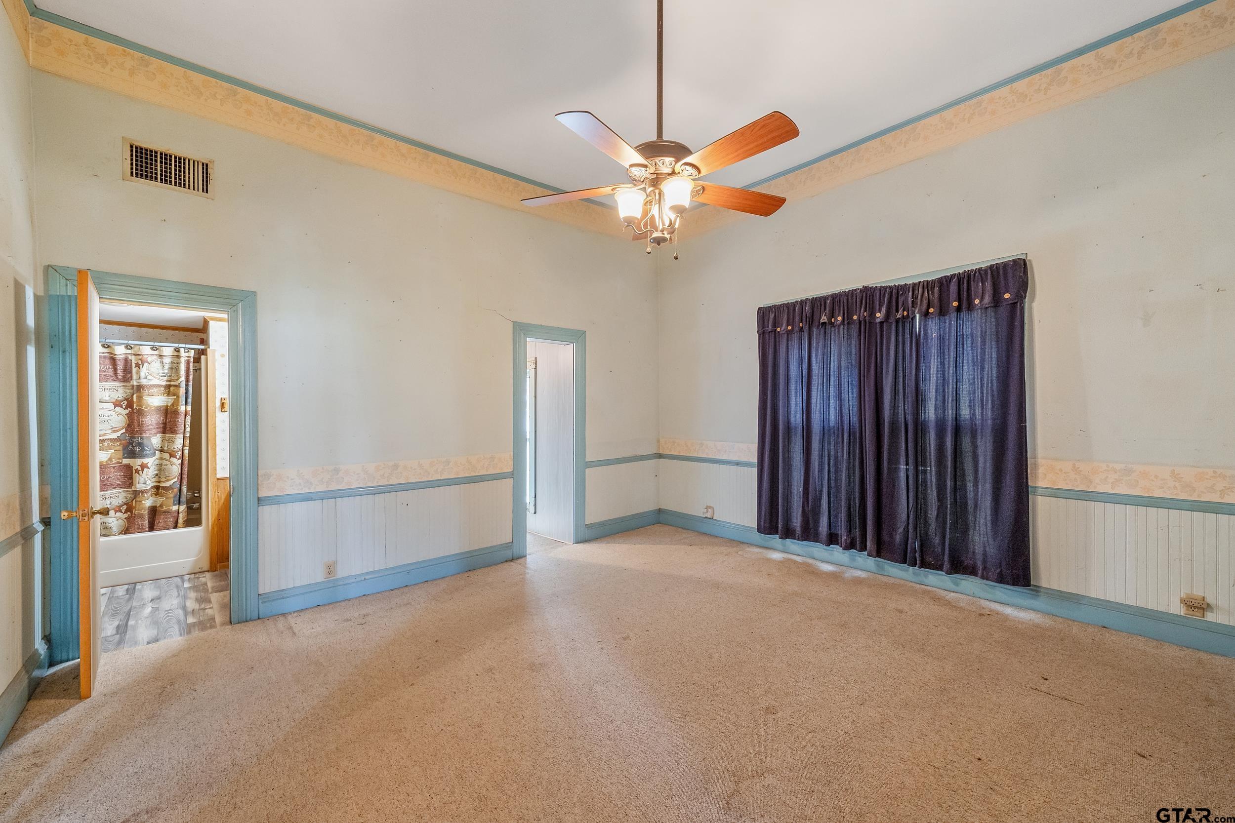 2888 Farm To Market Road 999 Gary, TX 75643 - Photo 11 of 46 a view of an empty room with a window