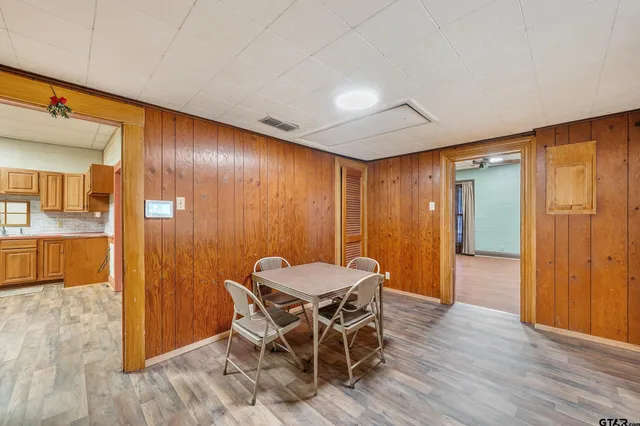 a view of a livingroom with furniture a dinning room and hallway