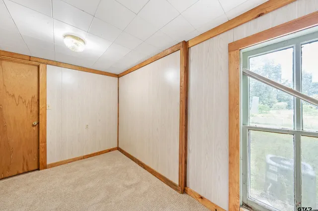 a view of an empty room with a large window