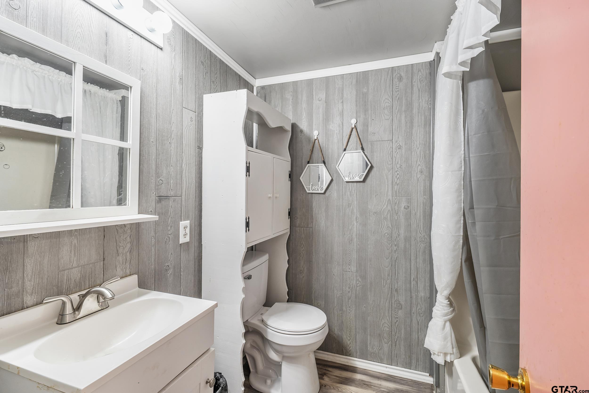 2888 Farm To Market Road 999 Gary, TX 75643 - Photo 19 of 46 a bathroom with a sink toilet and shower