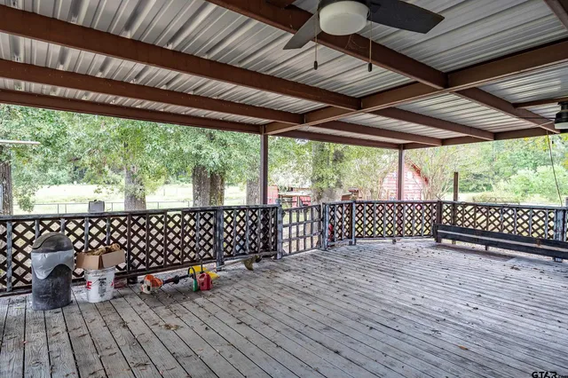 a view of a porch with wooden floor