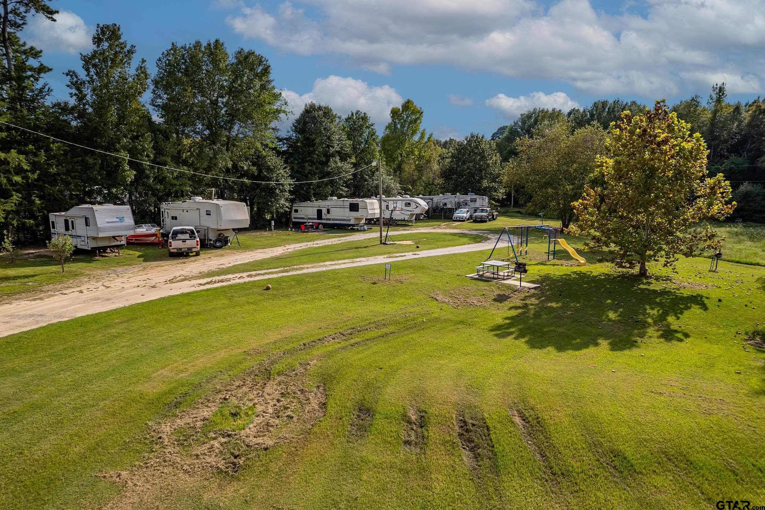 2888 Farm To Market Road 999 Gary, TX 75643 - Photo 26 of 46 a swimming pool view with a outdoor seating