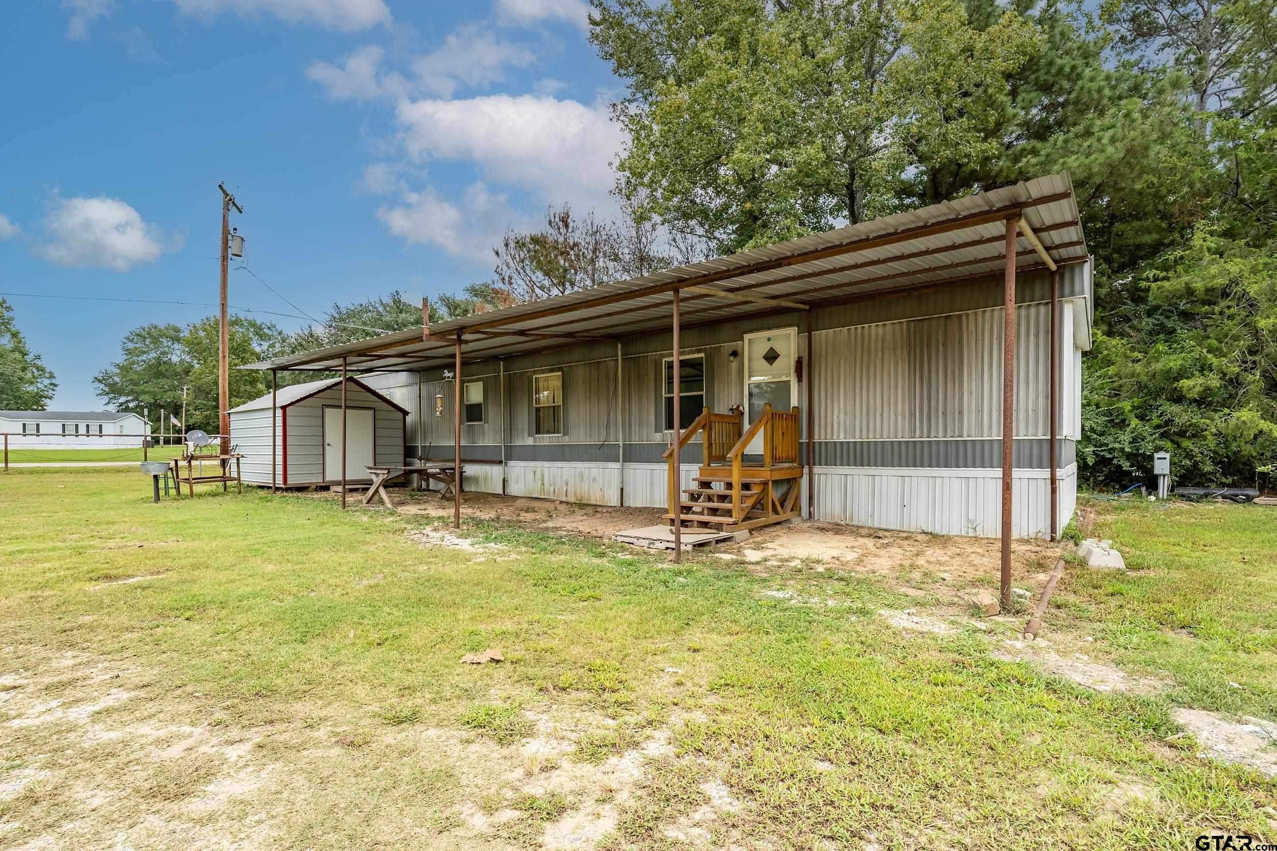 2888 Farm To Market Road 999 Gary, TX 75643 - Photo 27 of 46 a view of back yard of the house