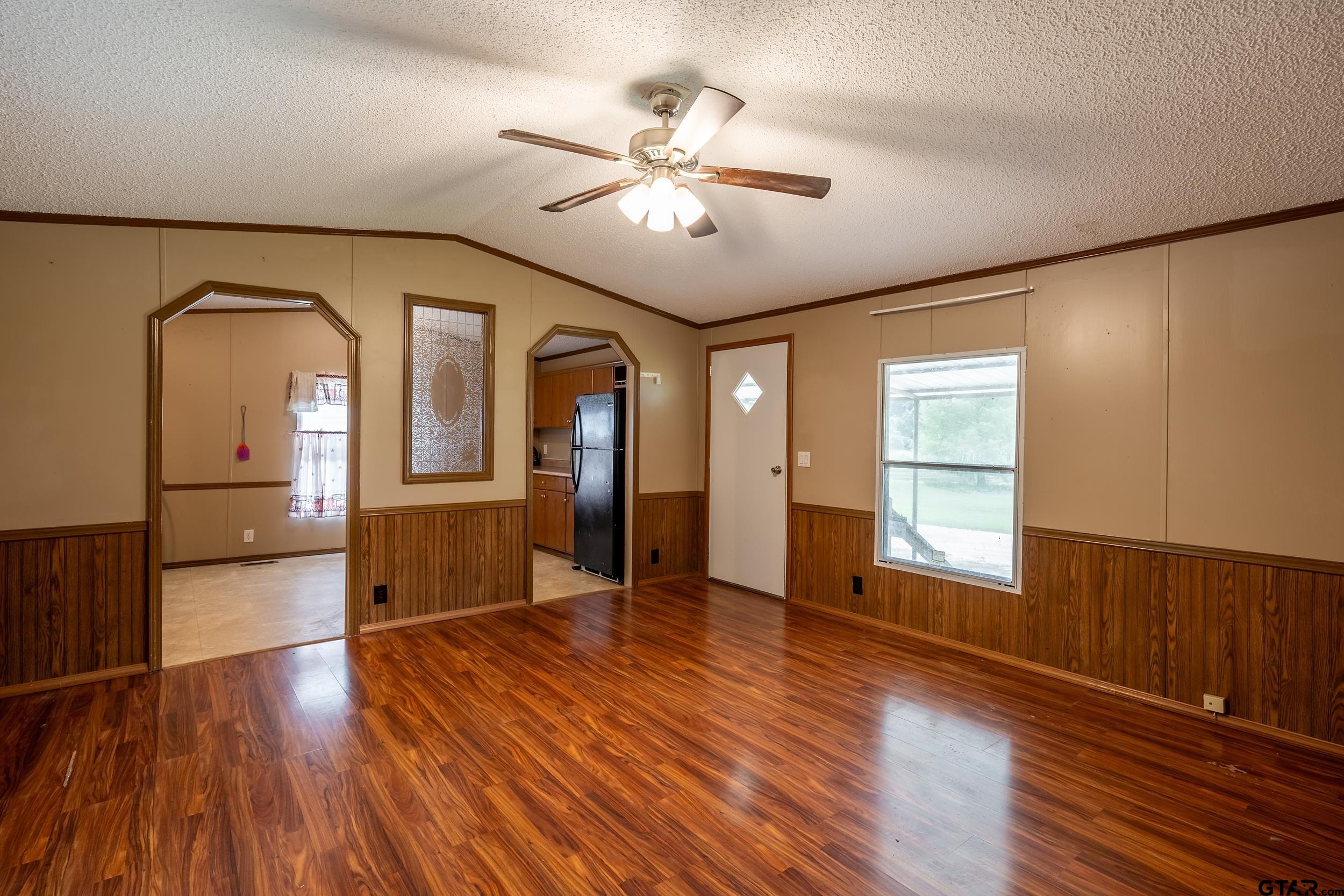 2888 Farm To Market Road 999 Gary, TX 75643 - Photo 29 of 46 a view of empty room with wooden floor and fan