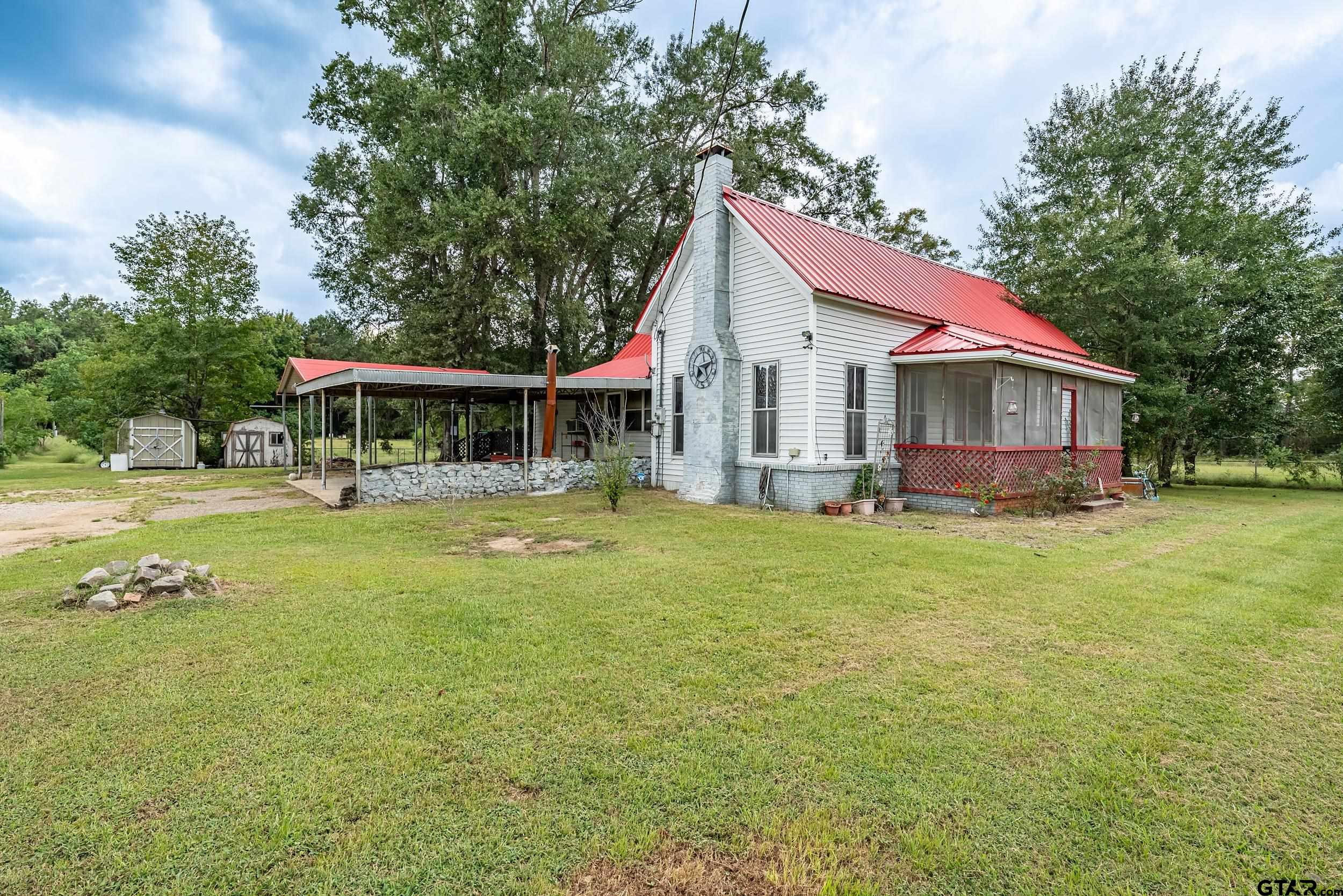 2888 Farm To Market Road 999 Gary, TX 75643 - Photo 3 of 46 a view of house with outdoor space and swimming pool