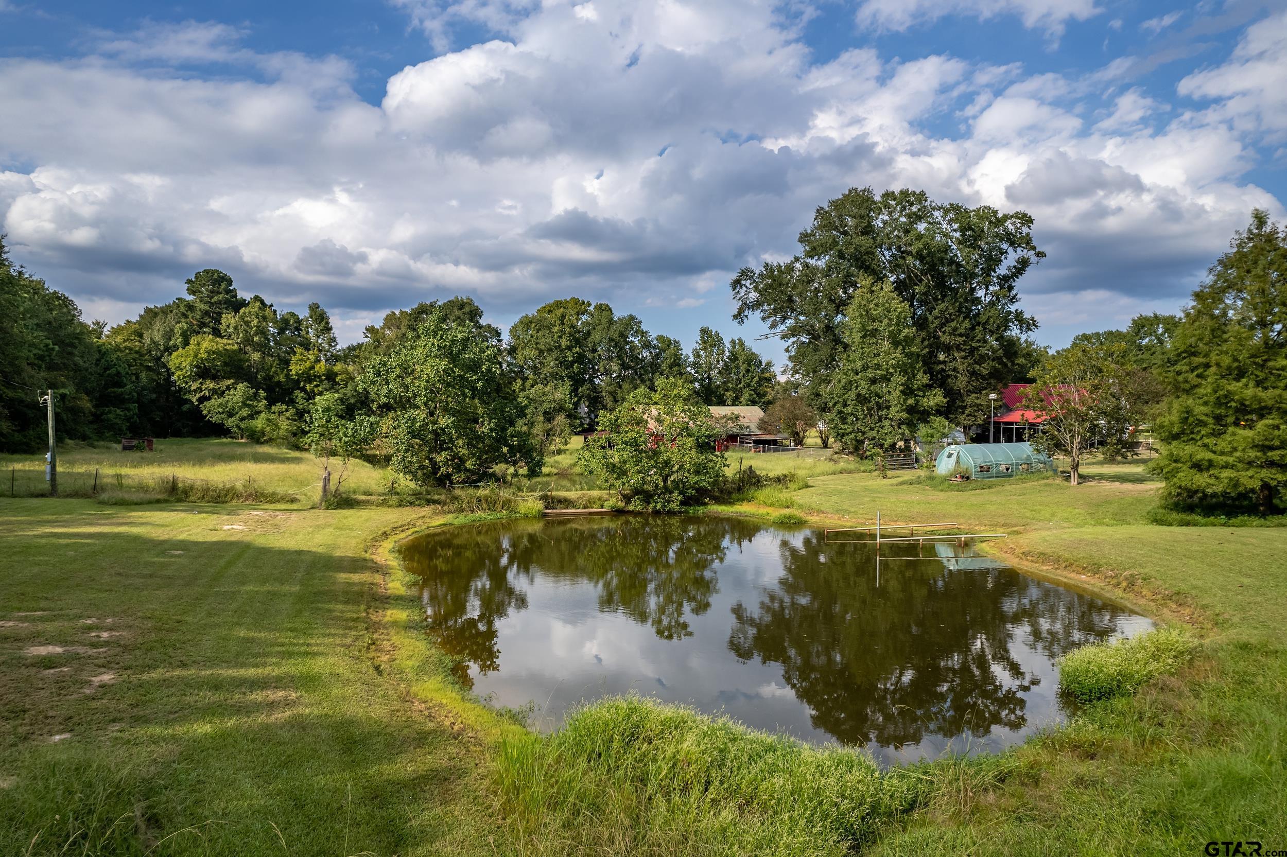 2888 Farm To Market Road 999 Gary, TX 75643 - Photo 42 of 46 a view of a lake with a big yard