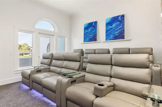 an aerial view of a house with a ocean view