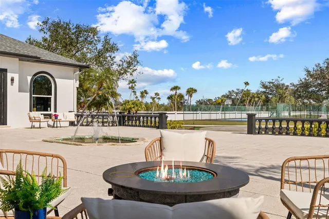 a large kitchen with stainless steel appliances a large counter top and a wooden floors